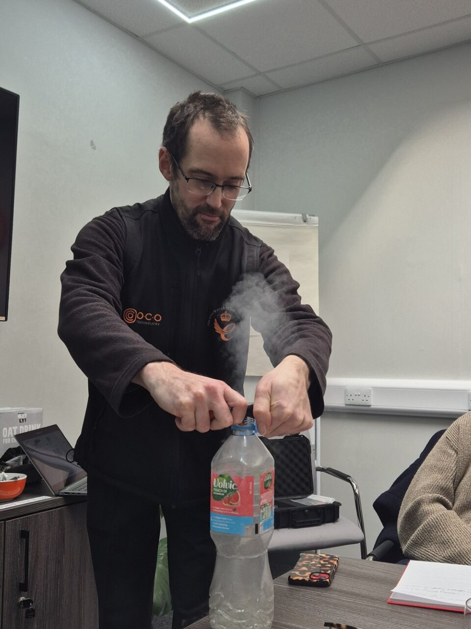 Demonstrating how the science behind the technology works with a plastic bottle and Co2.